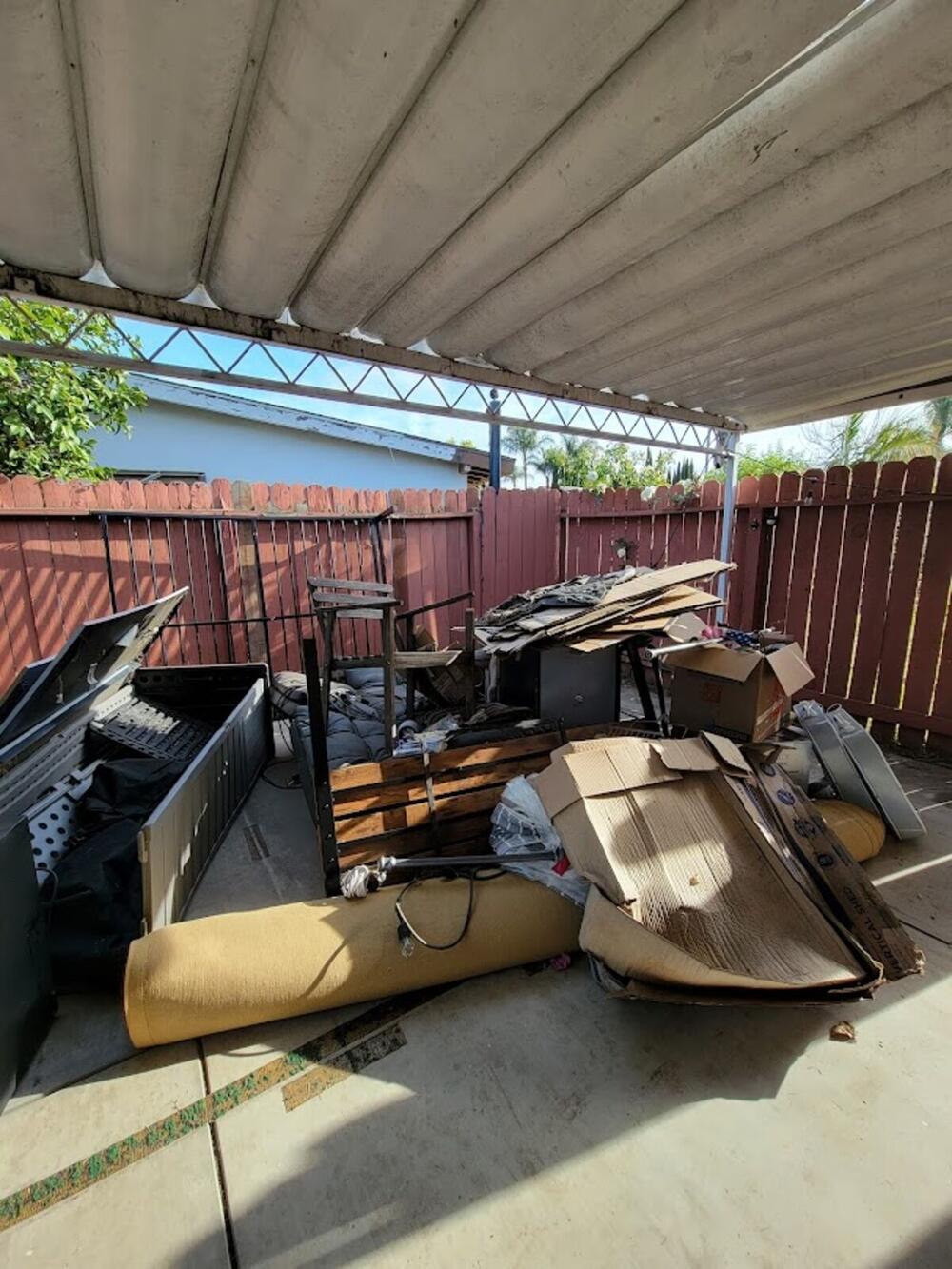 Patio cleanout with furniture and debris